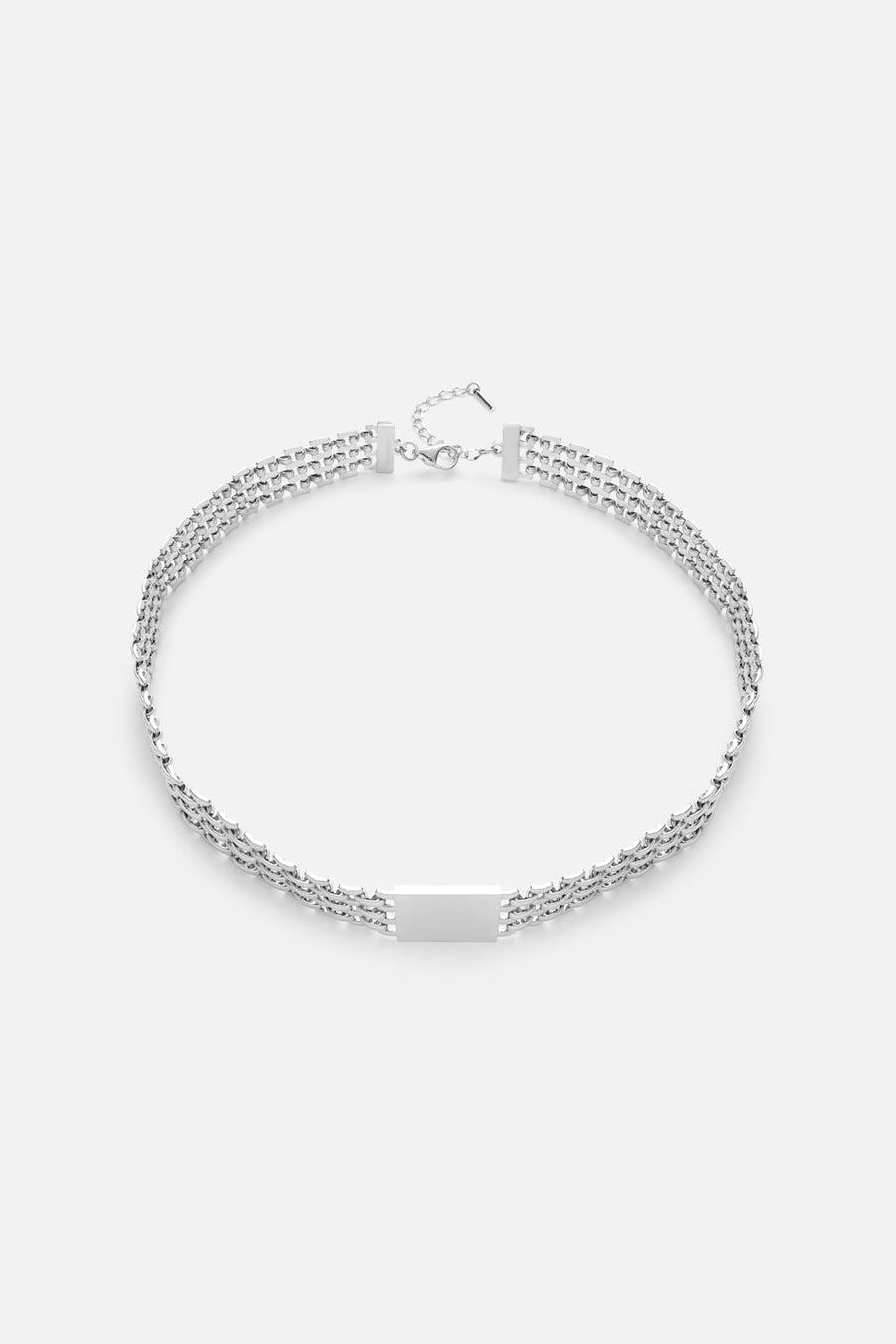 Silver-tone layered chain necklace, front view on a light background
