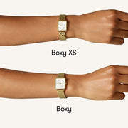 Size comparison of two square watches on a wrist
