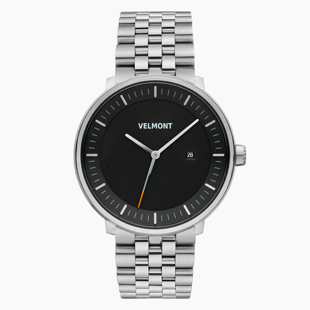 Black-dial watch with a date window on a silver-tone five-row link bracelet.
