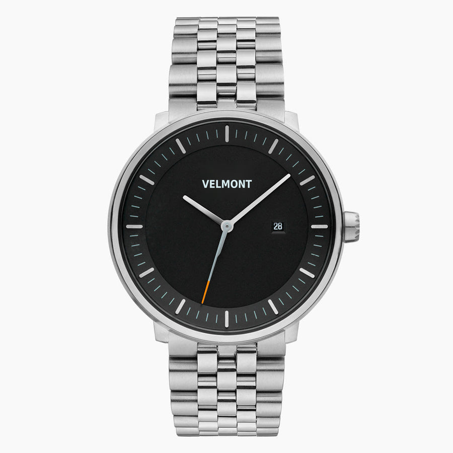 Black-dial watch with a date window on a silver-tone five-row link bracelet.