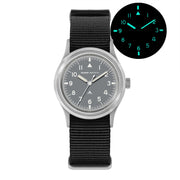 Gray-dial field watch with glow inset