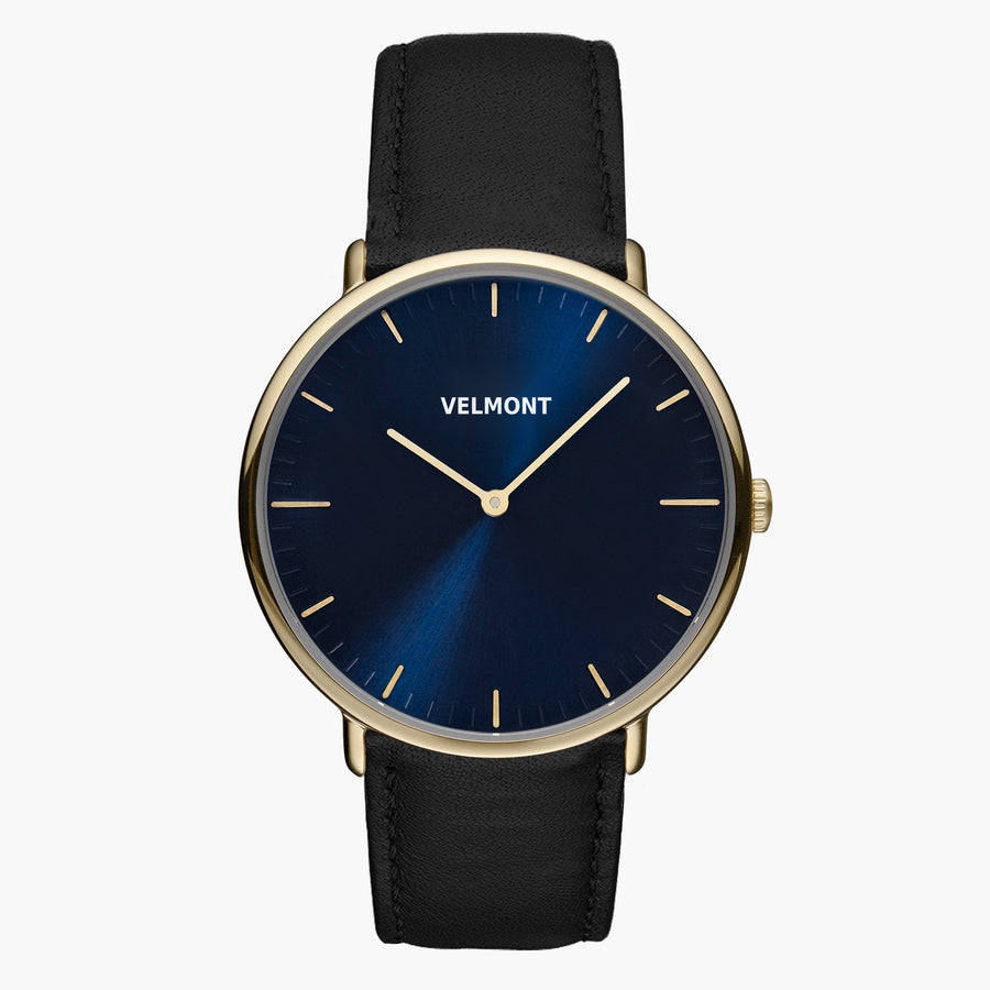 A blue sunburst dial framed by a slim gold-tone case, set on a black strap.