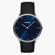 Watch with a blue sunburst dial and silver-tone case on a smooth black strap.