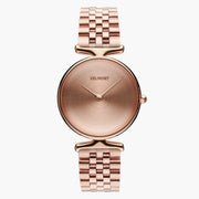 Rose gold-tone watch with a sunburst dial and multi-link bracelet, front view.