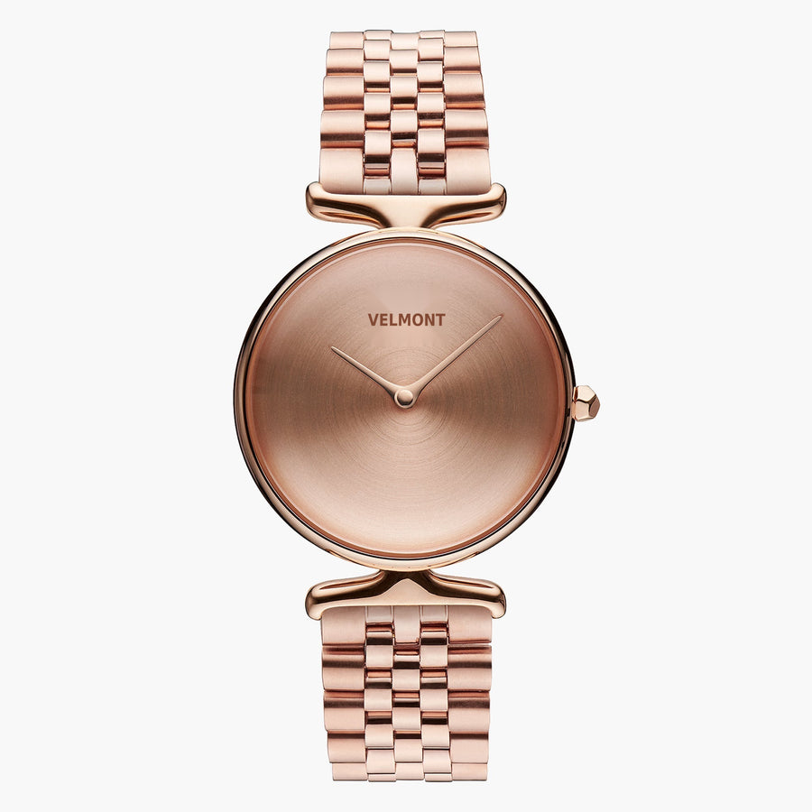 Rose gold-tone watch with a sunburst dial and multi-link bracelet, front view.