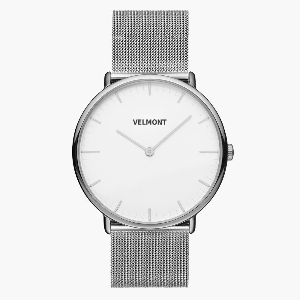 White-dial watch in a silver-tone case on a matching silver-tone mesh strap.