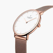 Angled view of the rose gold-tone case, crown and fine mesh.