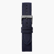 Navy textured fabric watch strap with stitched edges and a gunmetal pin buckle.