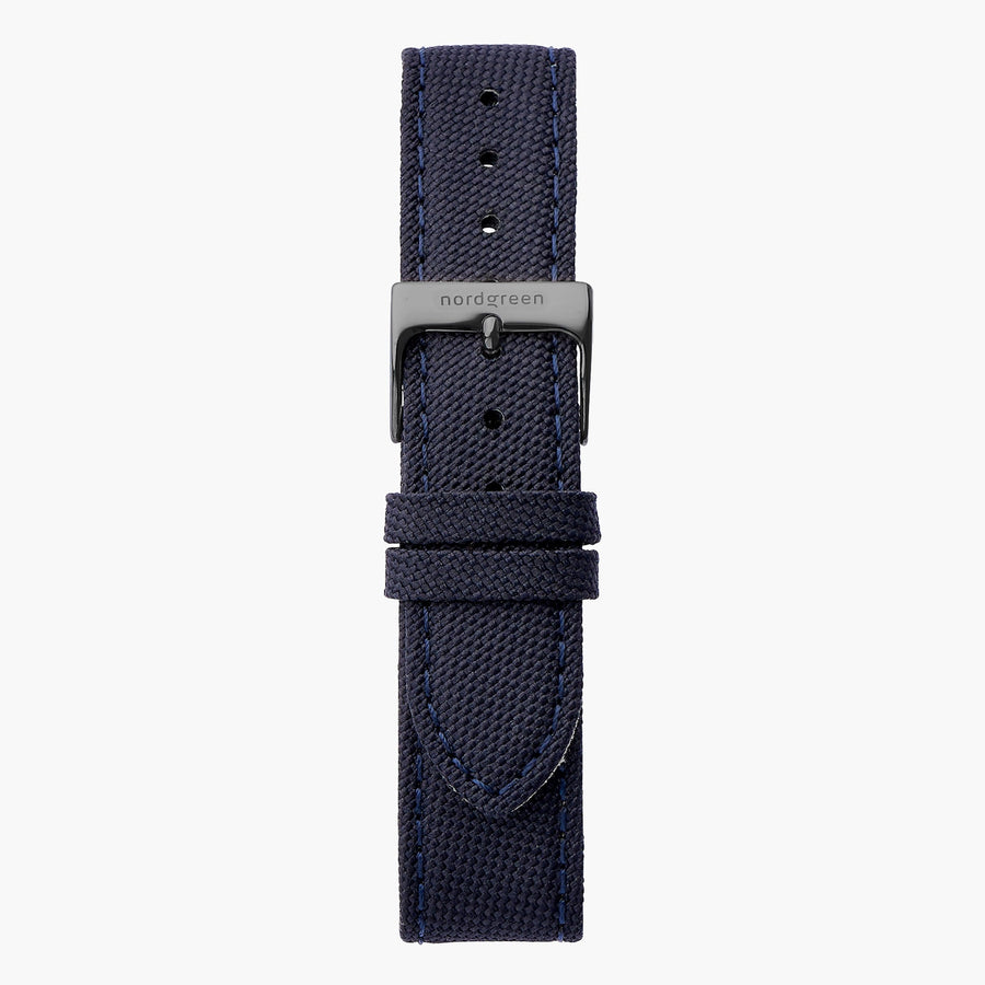 Navy textured fabric watch strap with stitched edges and a gunmetal pin buckle.