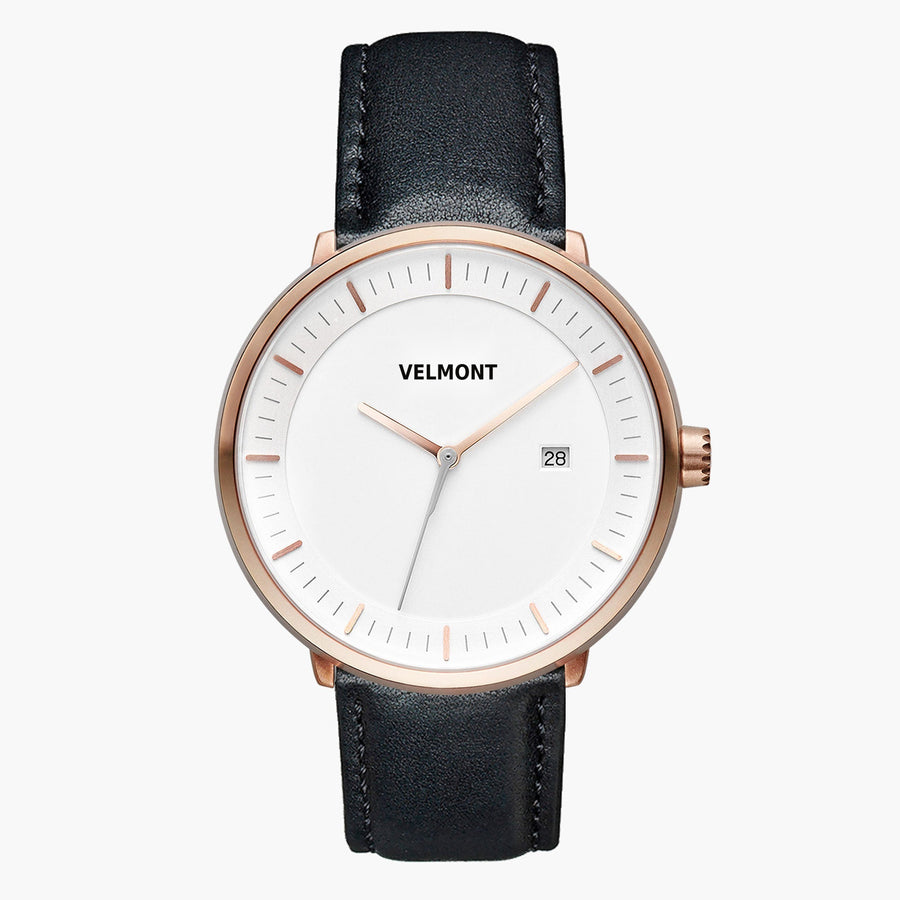 Watch with a white dial and rose gold-tone case on a smooth black strap.