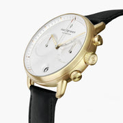 Angled view of the gold-tone pushers, crown and two-subdial white face.