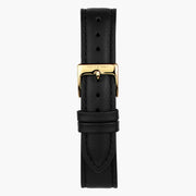 Black strap with a gold-tone pin buckle, shown upright.