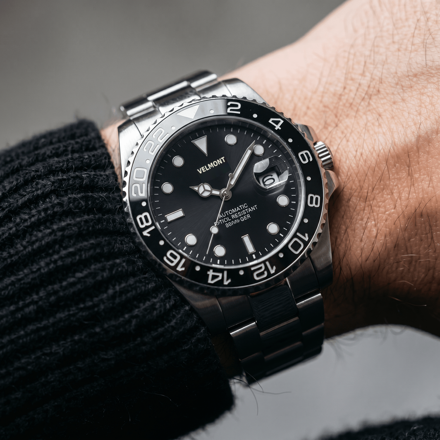 Black bezel watch on the wrist
