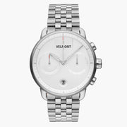 Chronograph-style watch with a white dial on a silver-tone five-row link bracelet.