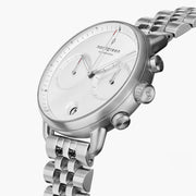 Angled view of the white dial, subdials and the multi-link bracelet.