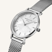 Close-up of the iridescent dial and silver case