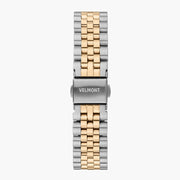 Detached two-tone silver and gold-tone link bracelet fastened with a silver-tone fold-over clasp.
