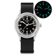 Black-dial field watch with cream hands and glow inset