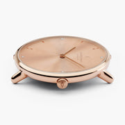 Side profile of the rose gold-tone case showing the knurled crown.