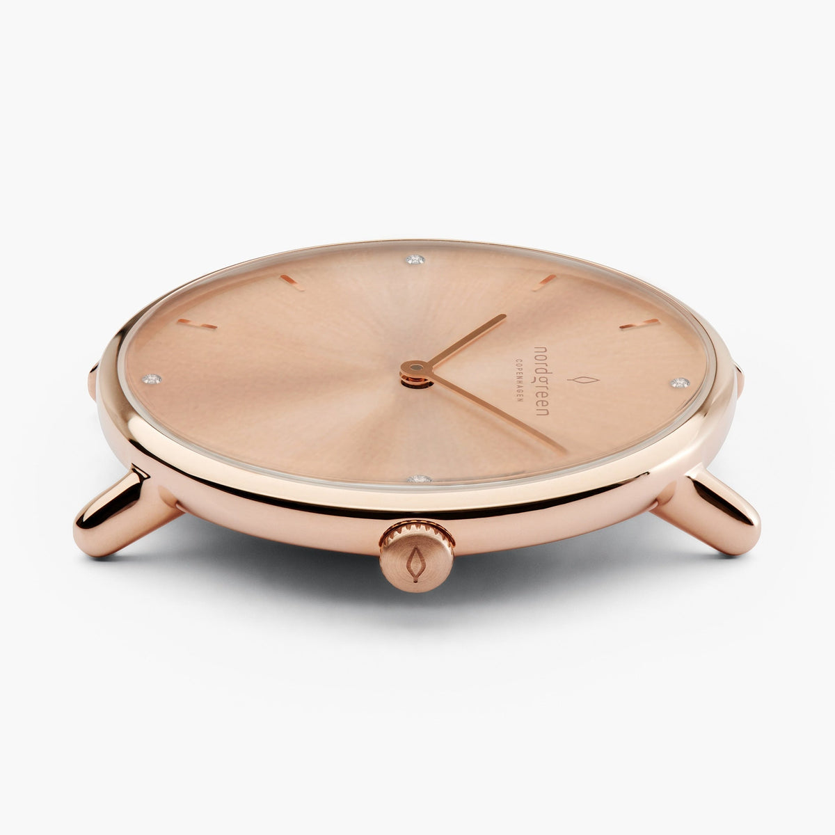 Side profile of the rose gold-tone case showing the knurled crown.