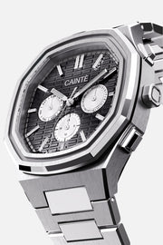 Three-quarter view of the octagonal case and black day-date dial