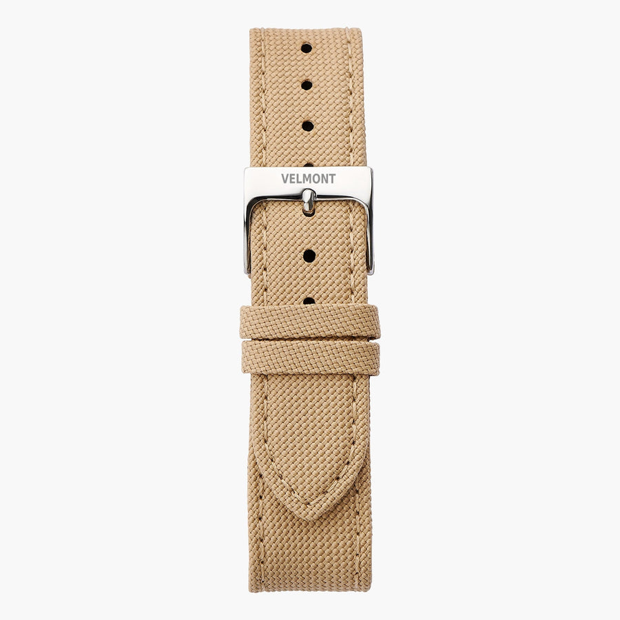 Beige textured fabric strap with tonal stitching and a polished silver-tone buckle.