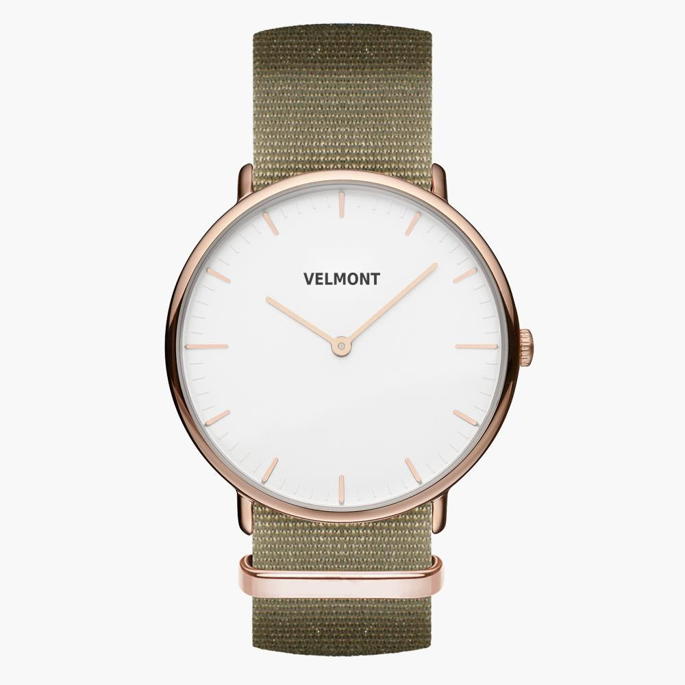 Slim rose gold-tone watch with a white two-hand dial on an olive green fabric strap.