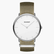 Watch with a white dial and silver-tone case on an olive green woven strap, shown from the front.