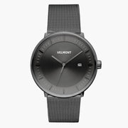 Front view of a gunmetal watch with a gunmetal gray sunburst dial on a gunmetal mesh strap.