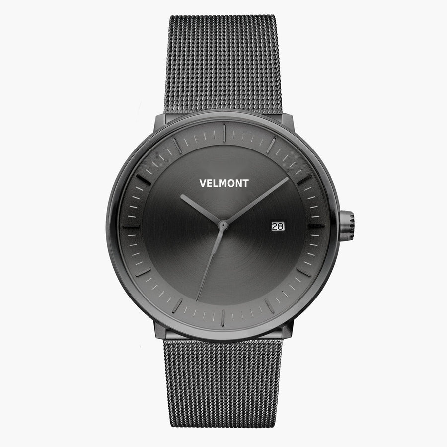 Front view of a gunmetal watch with a gunmetal gray sunburst dial on a gunmetal mesh strap.