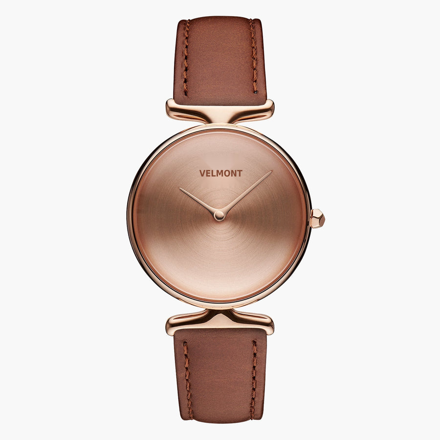 Watch with a rose gold-tone dial and case on a caramel brown strap, front view.