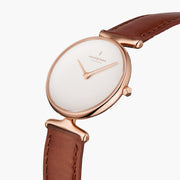 Angled view of the sculpted rose gold-tone lugs and faceted crown.