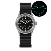 Black-dial field watch with glow inset, front view