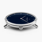 Edge-on view of the silver-tone case, lugs and crown without the strap.