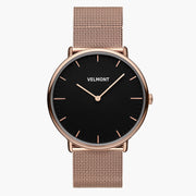 Watch with a black dial and rose gold-tone case on a rose gold-tone mesh strap, shown from the front.