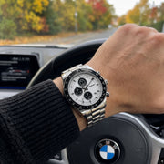 Panda chronograph on a wrist at the steering wheel