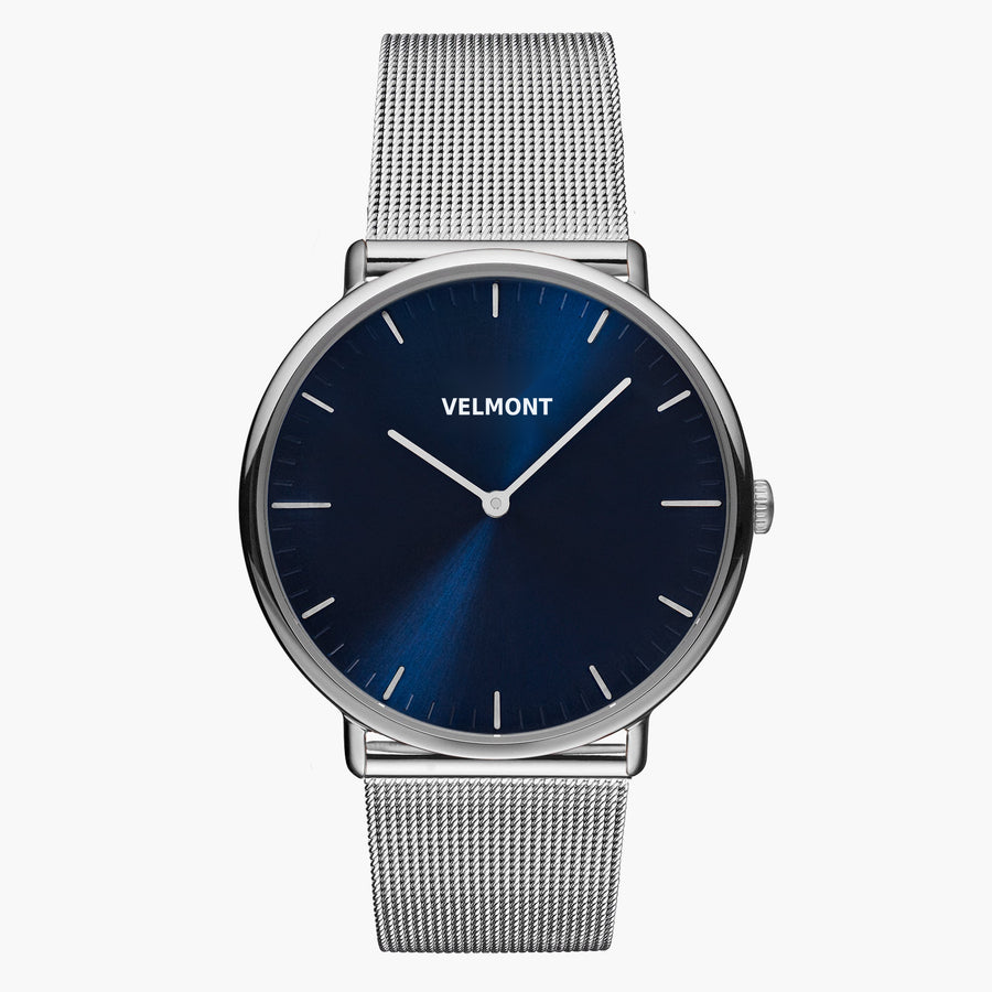 Navy sunburst dial in a silver-tone case on a silver-tone mesh strap.