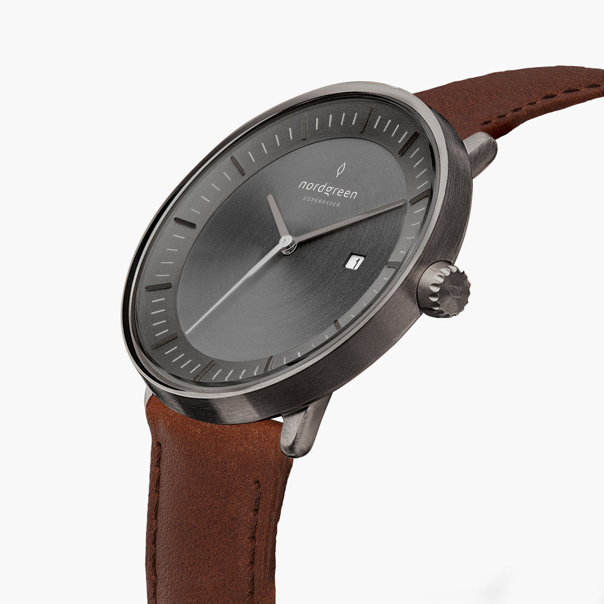 Three-quarter view of the gunmetal case and gray dial on a brown strap.
