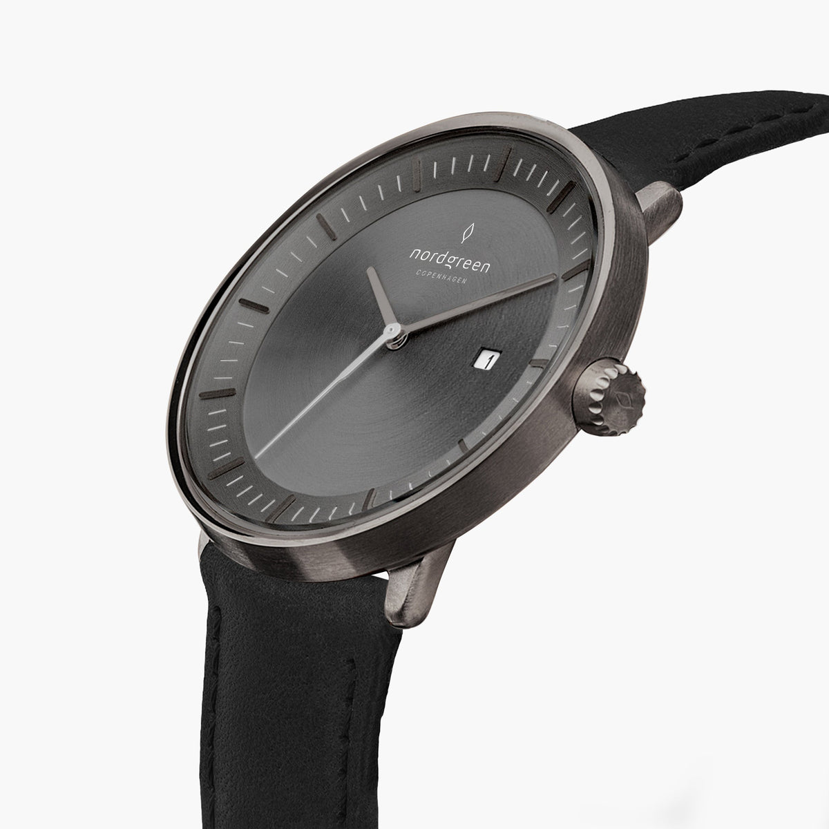 Watch turned at an angle, gunmetal gray sunburst dial and gunmetal bezel catching the light.