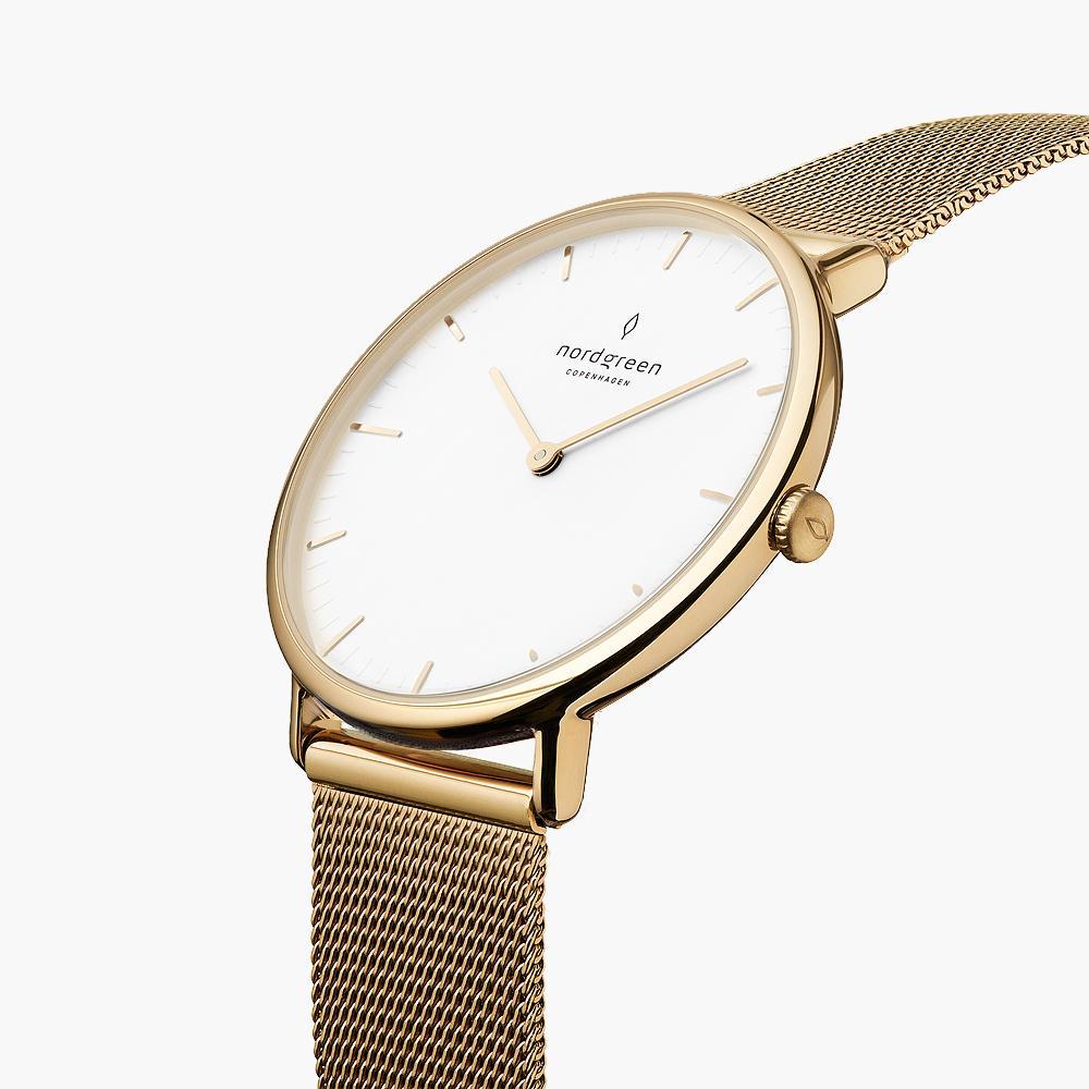 Angled view of the thin gold-tone case and white dial with gold-tone hands.