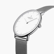 Silver-tone case and crown viewed at an angle with the mesh strap.