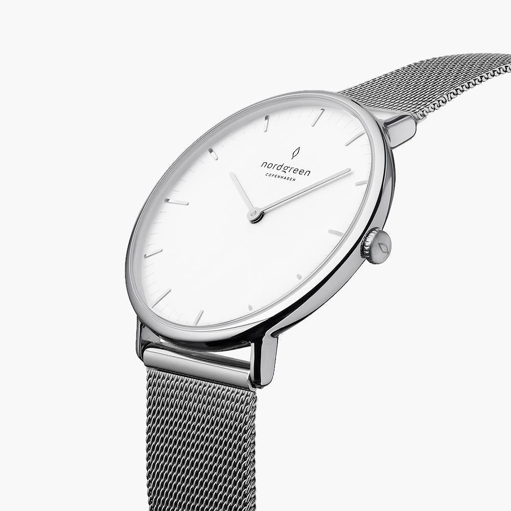 Silver-tone case and crown viewed at an angle with the mesh strap.