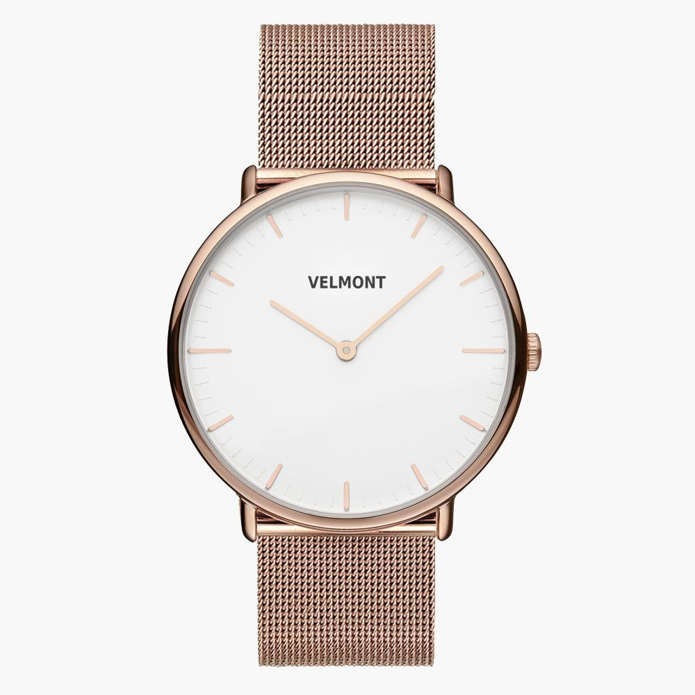 White-dial watch in rose gold tone with a fine mesh strap, front facing.