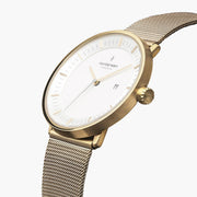 Gold-tone 40 mm watch with white dial at an angle, showing the date window