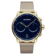 Gold-tone chronograph-style watch with a navy blue dial on a gold-tone mesh strap.