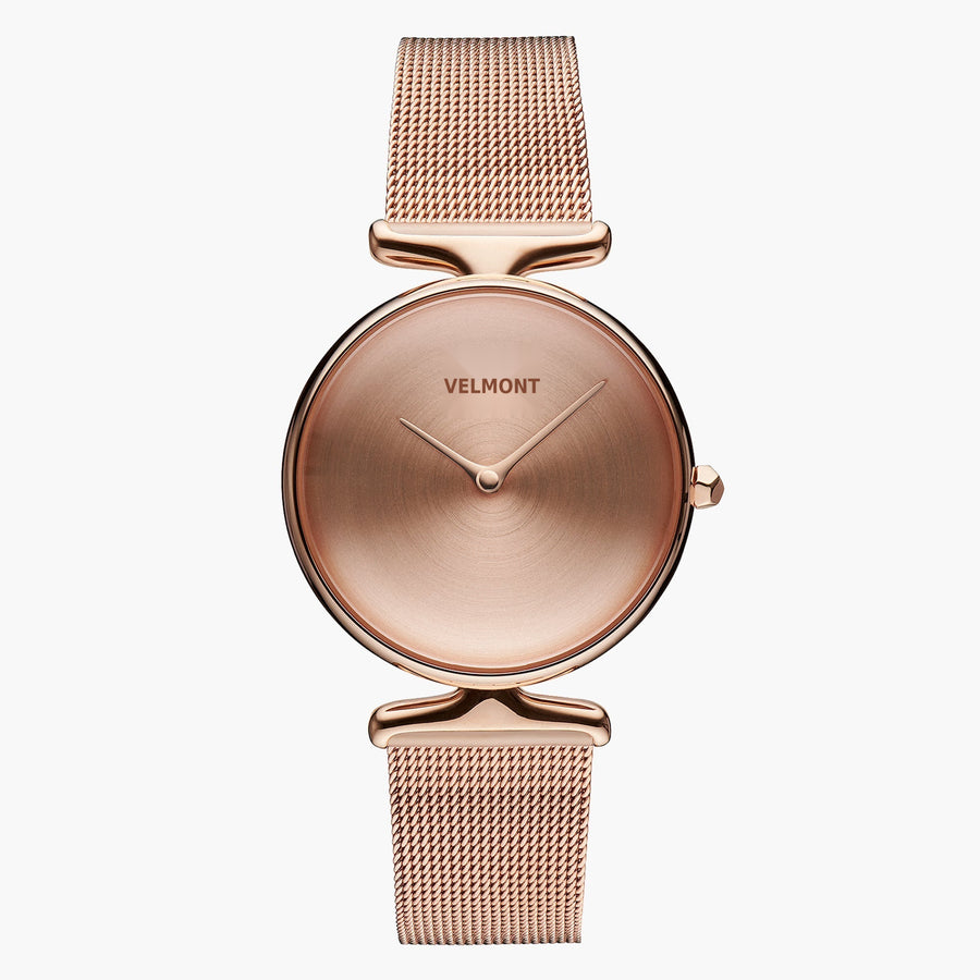 All rose gold-tone watch with a plain dial, sculpted lugs and mesh strap.