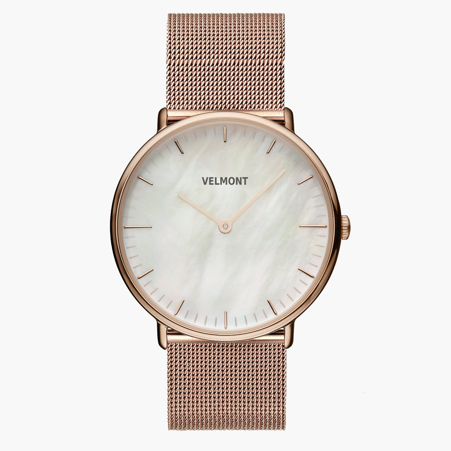 Watch with a pearlescent white dial and rose gold-tone case on a matching mesh strap.