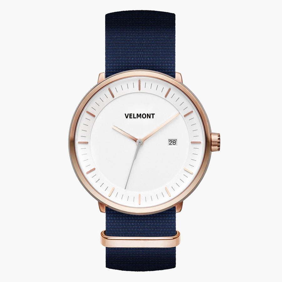 Watch with a white dial and rose gold-tone case on a navy woven strap.