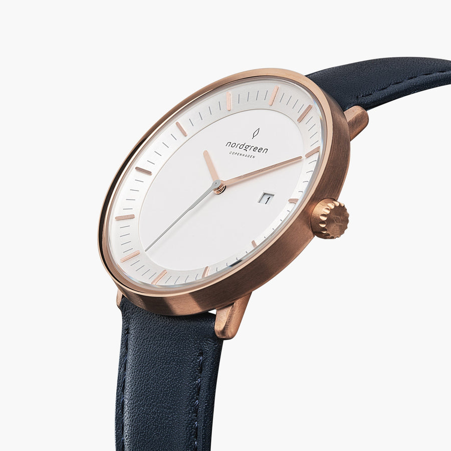 Angled view of the white dial, date window and rose gold-tone crown.