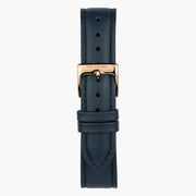 Navy strap with tonal stitching and a rose gold-tone pin buckle.